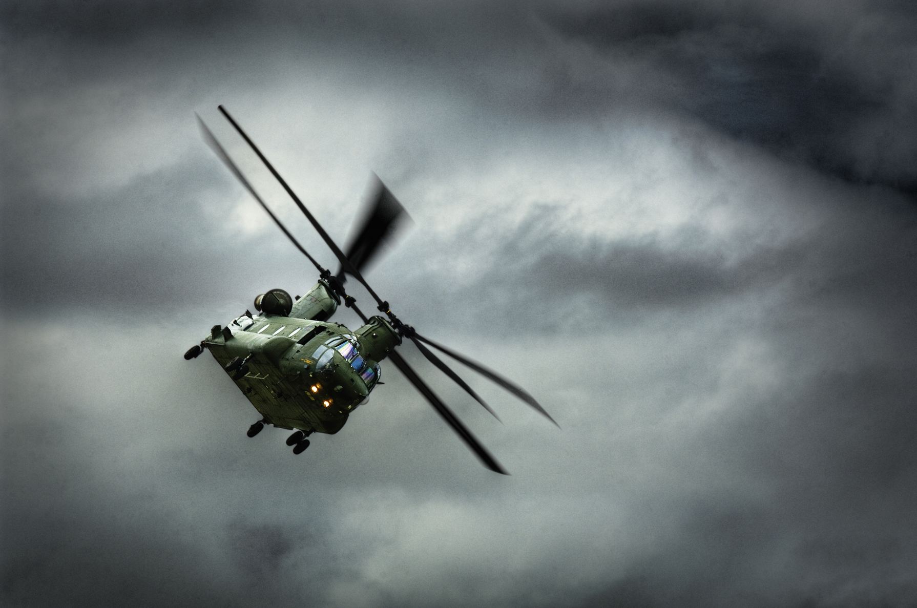 Chinook helicopter in a heavy sky